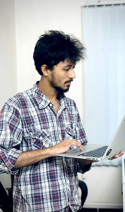 Marketing consultant holding a laptop